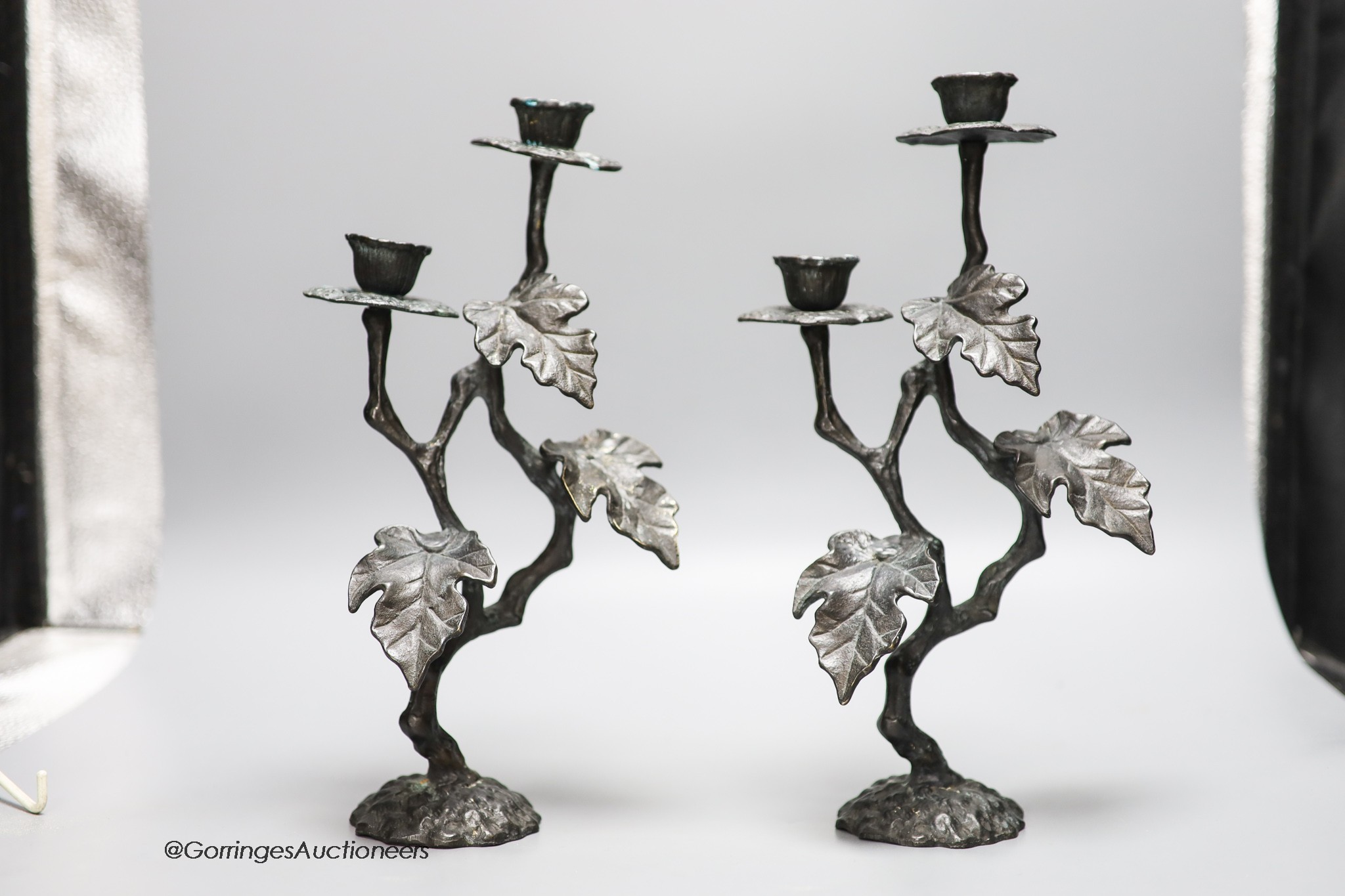 A pair of painted brass two branch candelabra, height 30cm